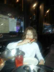 Jacob eating some Marra's Pizza